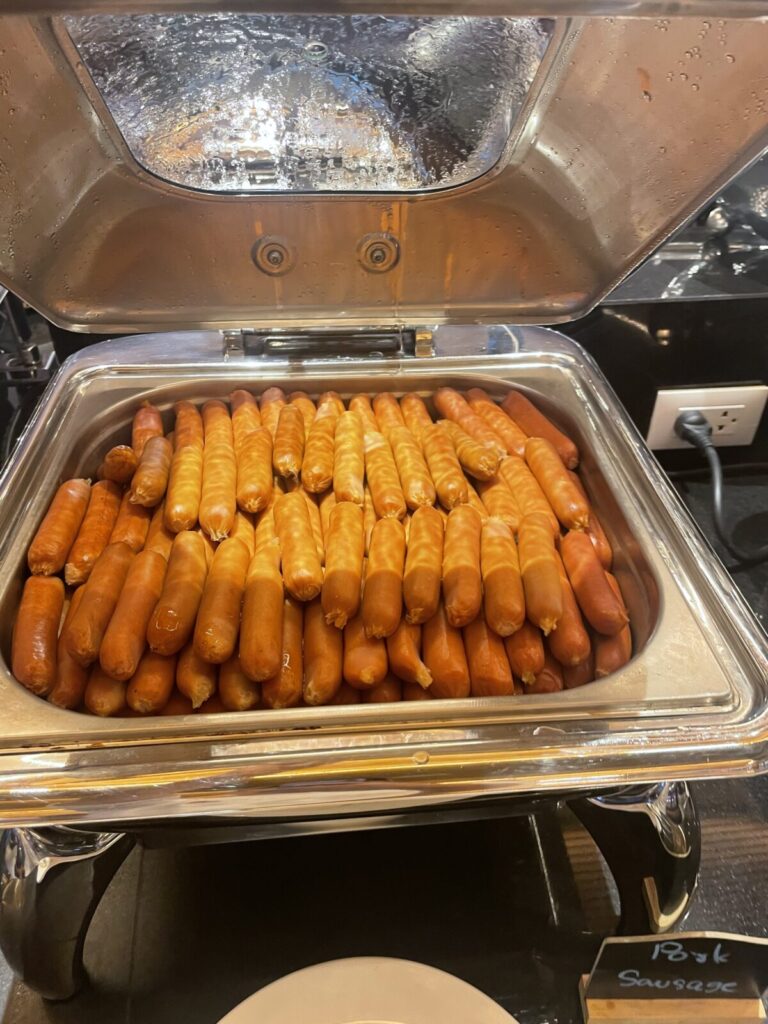 Pan of assorted sausages in two shades